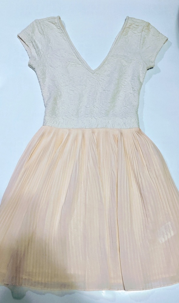 A Blush pink and creme fit and flare dress